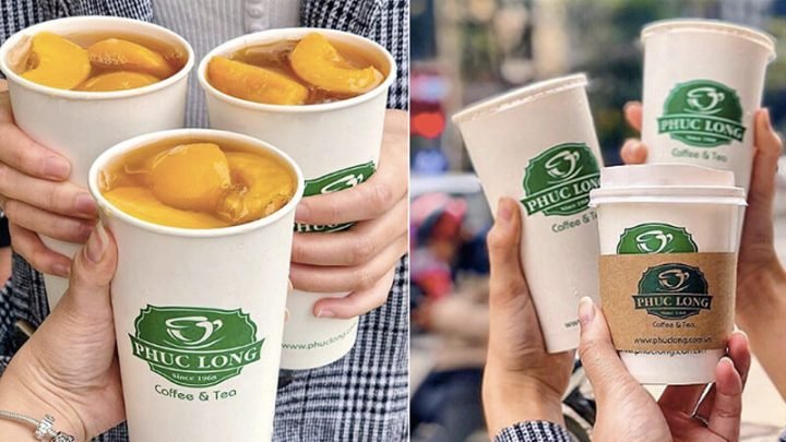 Trà Thơm Hạt Đác Bao Nhiêu Calo? Khám phá Năng lượng và Lợi ích Sức khỏe Cô gái cầm ly trà thơm hạt đác màu vàng tươi mát với lát dứa và hạt đác bên trên