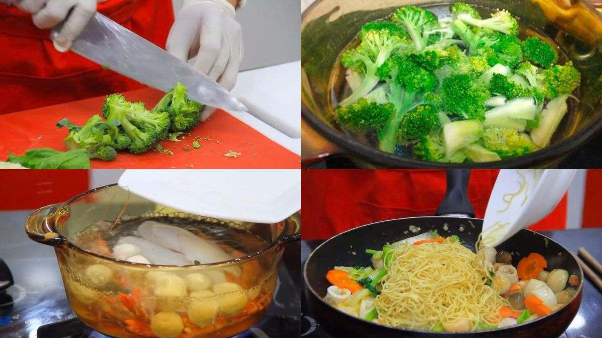 Đĩa mì gói xào hải sản đầy màu sắc với tôm, mực, cá viên và rau củ tươi ngon, hấp dẫn.