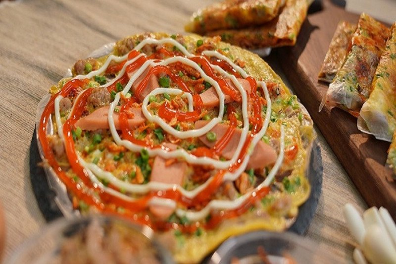 Hình ảnh mô tả việc ăn bánh tráng nướng quá nhiều có thể dẫn đến tăng cân không mong muốn