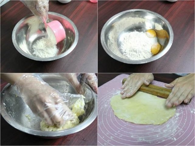 Vỏ bánh trứng nướng đang được cán mỏng trên thớt gỗ để chuẩn bị cho công đoạn tiếp theo.